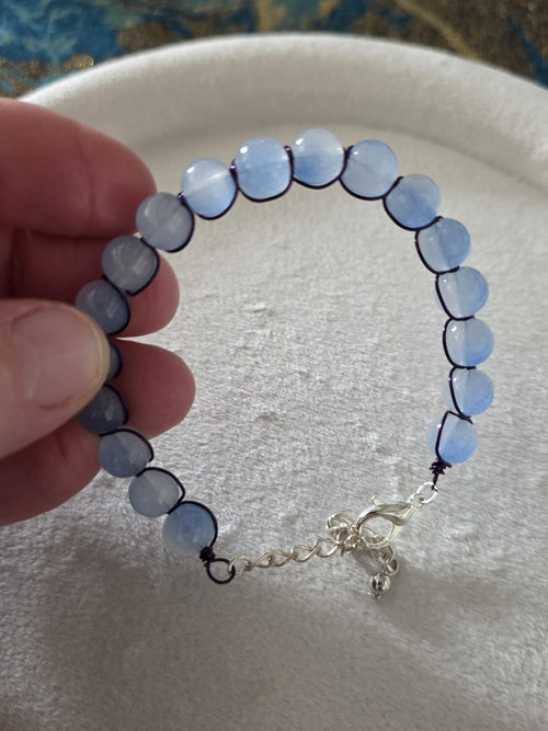Blue glass bead bracelet with metal braid