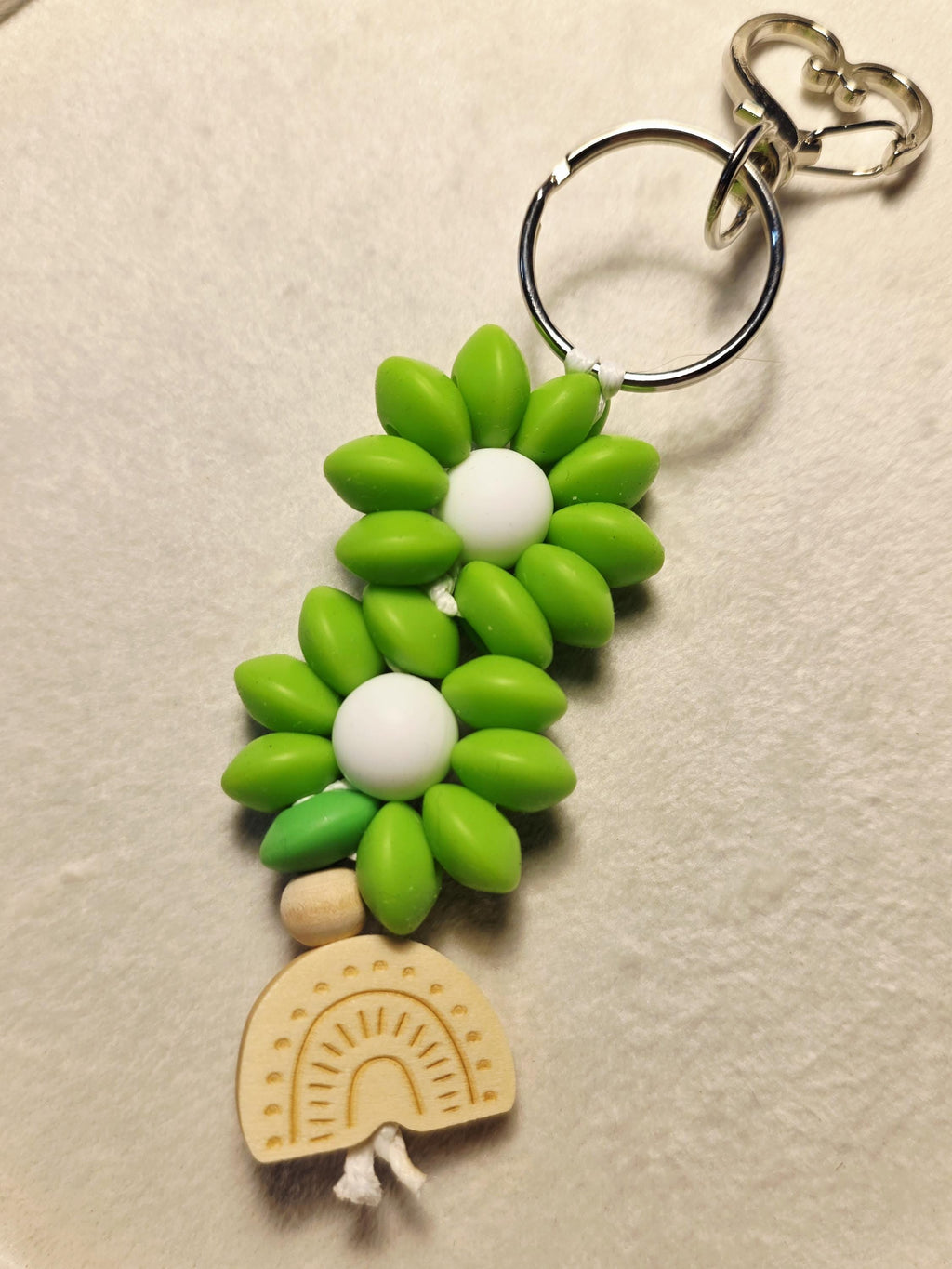 Daisy bloom keychain with wooden rainbow charm